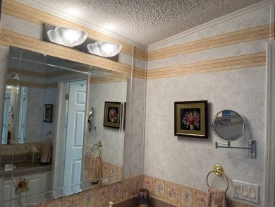 Step Inside This Exceptional Home: Your Dream Awaits!    Homes on Four Lakes Golf Club in Florida - for sale on GolfHomes.com, golf home, golf lot