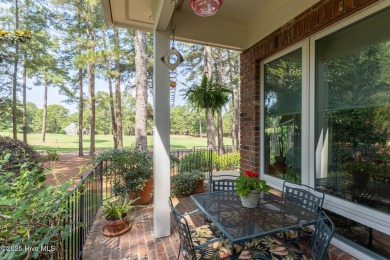 Experience elegant living in this stunning golf front home on Pinewild Country Club of Pinehurst in North Carolina - for sale on GolfHomes.com, golf home, golf lot