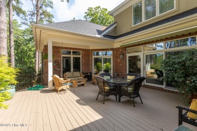 Experience elegant living in this stunning golf front home on Pinewild Country Club of Pinehurst in North Carolina - for sale on GolfHomes.com, golf home, golf lot