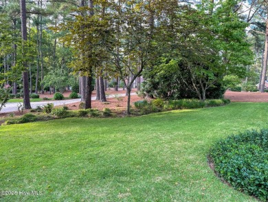 Experience elegant living in this stunning golf front home on Pinewild Country Club of Pinehurst in North Carolina - for sale on GolfHomes.com, golf home, golf lot
