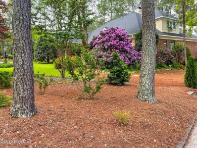 Experience elegant living in this stunning golf front home on Pinewild Country Club of Pinehurst in North Carolina - for sale on GolfHomes.com, golf home, golf lot