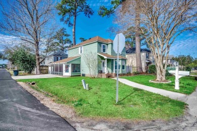 Welcome to this stunning Colonial style home nestled in a quiet on Myrtlewood Golf Course and Club  in South Carolina - for sale on GolfHomes.com, golf home, golf lot
