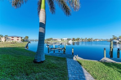 Fall in love with this 2015 built custom waterfront pool home on Saint Andrews South Golf Club in Florida - for sale on GolfHomes.com, golf home, golf lot