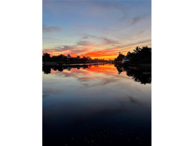 Fall in love with this 2015 built custom waterfront pool home on Saint Andrews South Golf Club in Florida - for sale on GolfHomes.com, golf home, golf lot