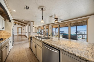 Welcome to your dream waterfront retreat in Cedar Creek Country on Cedar Creek Country Club in Texas - for sale on GolfHomes.com, golf home, golf lot