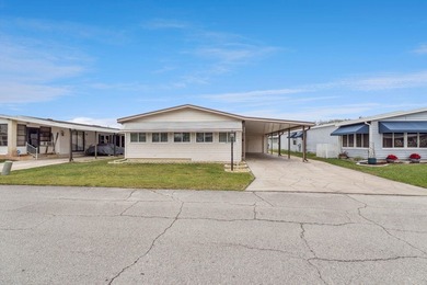 Welcome home to this well-loved, fully furnished 2-bedroom on Lake Henry Golf Club in Florida - for sale on GolfHomes.com, golf home, golf lot