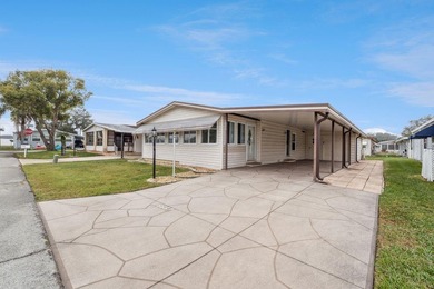 Welcome home to this well-loved, fully furnished 2-bedroom on Lake Henry Golf Club in Florida - for sale on GolfHomes.com, golf home, golf lot