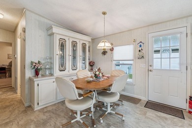 Welcome home to this well-loved, fully furnished 2-bedroom on Lake Henry Golf Club in Florida - for sale on GolfHomes.com, golf home, golf lot