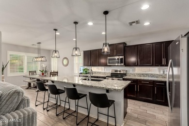 This well-appointed home pairs refined interior finishes with on The Golf Club At Johnson Ranch in Arizona - for sale on GolfHomes.com, golf home, golf lot