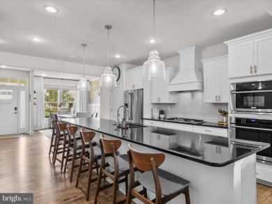 Welcome to 24262 Canoe Drive, an exquisite townhome villa on The Peninsula Golf and Country Club in Delaware - for sale on GolfHomes.com, golf home, golf lot