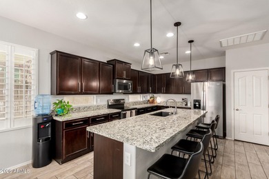 This well-appointed home pairs refined interior finishes with on The Golf Club At Johnson Ranch in Arizona - for sale on GolfHomes.com, golf home, golf lot