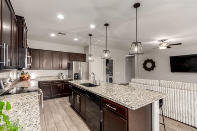 This well-appointed home pairs refined interior finishes with on The Golf Club At Johnson Ranch in Arizona - for sale on GolfHomes.com, golf home, golf lot