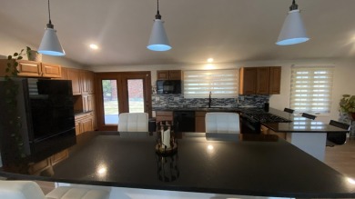 Beautiful Updated Home by the Golf Course across from Lake of on Lakes of the Four Seasons Country Club in Indiana - for sale on GolfHomes.com, golf home, golf lot