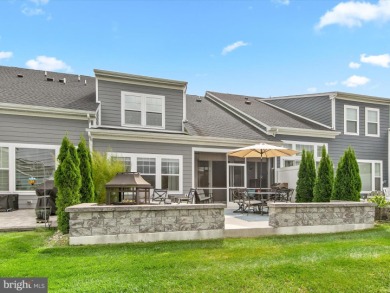 Welcome to 24262 Canoe Drive, an exquisite townhome villa on The Peninsula Golf and Country Club in Delaware - for sale on GolfHomes.com, golf home, golf lot