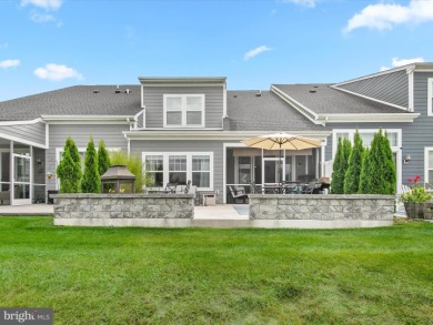 Welcome to 24262 Canoe Drive, an exquisite townhome villa on The Peninsula Golf and Country Club in Delaware - for sale on GolfHomes.com, golf home, golf lot