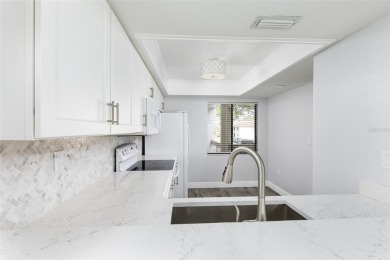 Lovely condo in a gated, golf course community!! This updated on East Lake Woodlands Country Club in Florida - for sale on GolfHomes.com, golf home, golf lot