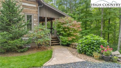 Welcome to your dream retreat. This charming log cabin is on Mountain Aire Golf Course in North Carolina - for sale on GolfHomes.com, golf home, golf lot