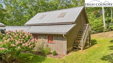 Welcome to your dream retreat. This charming log cabin is on Mountain Aire Golf Course in North Carolina - for sale on GolfHomes.com, golf home, golf lot