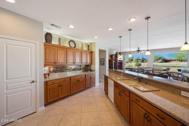 Experience luxury living in this exquisite 3 bed, 2 bath home on Sun City Grand Golf Couse and Club in Arizona - for sale on GolfHomes.com, golf home, golf lot