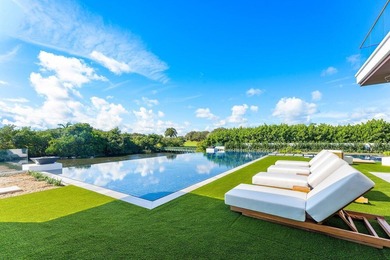 Step into unparalleled luxury in this brand-new custom estate on Jonathans Landing Golf Club in Florida - for sale on GolfHomes.com, golf home, golf lot