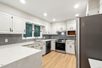 This beautifully updated ranch blends modern comfort with on Carolina Trace Country Club in North Carolina - for sale on GolfHomes.com, golf home, golf lot