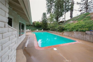 Welcome to this stunning one-story private pool home that backs on Canyon Crest Country Club in California - for sale on GolfHomes.com, golf home, golf lot