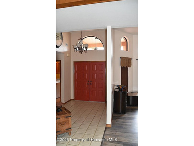 Nestled along the fairway of Hole 9 of the prestigious Oak Hills on Oak Hills Country Club in Florida - for sale on GolfHomes.com, golf home, golf lot