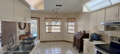 Nestled along the fairway of Hole 9 of the prestigious Oak Hills on Oak Hills Country Club in Florida - for sale on GolfHomes.com, golf home, golf lot