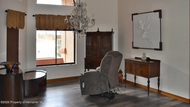 Nestled along the fairway of Hole 9 of the prestigious Oak Hills on Oak Hills Country Club in Florida - for sale on GolfHomes.com, golf home, golf lot