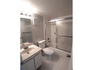 CHARMING 2 bed/ 2 bath, 3RD FLOOR LAKE FRONT CONDO located in on Sunrise Lakes Phase IV Golf Course in Florida - for sale on GolfHomes.com, golf home, golf lot