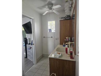 This Gorgeous home located in quiet Sunrise Golf Village. The on Sunrise Lakes Phase IV Golf Course in Florida - for sale on GolfHomes.com, golf home, golf lot