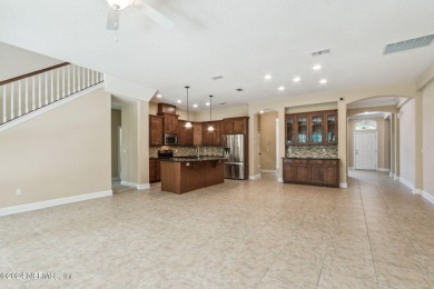 This 3736 square foot home in Eagle Harbor has 5 bedrooms & 4 on Eagle Harbor Golf Club in Florida - for sale on GolfHomes.com, golf home, golf lot