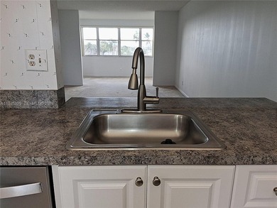 CHARMING 2 bed/ 2 bath, 3RD FLOOR LAKE FRONT CONDO located in on Sunrise Lakes Phase IV Golf Course in Florida - for sale on GolfHomes.com, golf home, golf lot