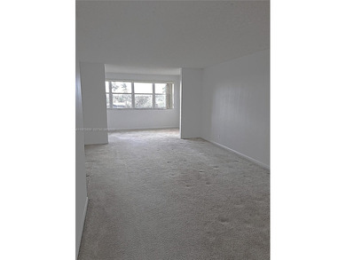 CHARMING 2 bed/ 2 bath, 3RD FLOOR LAKE FRONT CONDO located in on Sunrise Lakes Phase IV Golf Course in Florida - for sale on GolfHomes.com, golf home, golf lot