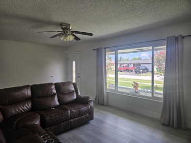 This Gorgeous home located in quiet Sunrise Golf Village. The on Sunrise Lakes Phase IV Golf Course in Florida - for sale on GolfHomes.com, golf home, golf lot