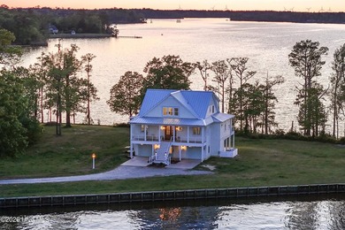Set on a rare 1.98-acre peninsula at the convergence of the on Sound Golf Links at Albemarle Plantation in North Carolina - for sale on GolfHomes.com, golf home, golf lot