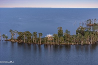 Set on a rare 1.98-acre peninsula at the convergence of the on Sound Golf Links at Albemarle Plantation in North Carolina - for sale on GolfHomes.com, golf home, golf lot