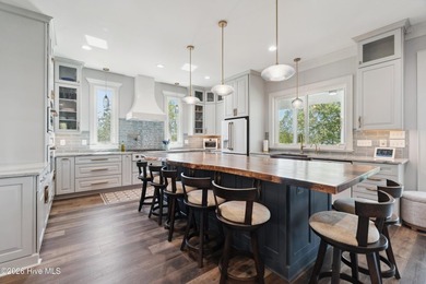 Set on a rare 1.98-acre peninsula at the convergence of the on Sound Golf Links at Albemarle Plantation in North Carolina - for sale on GolfHomes.com, golf home, golf lot