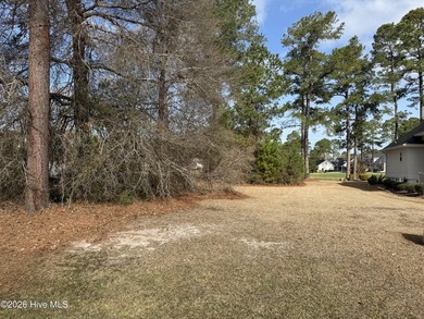 Beautiful 1/3-acre lot on the pond overlooking the fairway on #9 on Brunswick Plantation and Golf Resorts in North Carolina - for sale on GolfHomes.com, golf home, golf lot