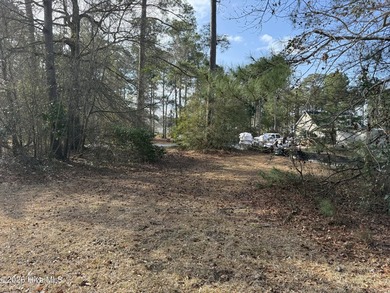 Beautiful 1/3-acre lot on the pond overlooking the fairway on #9 on Brunswick Plantation and Golf Resorts in North Carolina - for sale on GolfHomes.com, golf home, golf lot