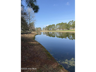 Beautiful 1/3-acre lot on the pond overlooking the fairway on #9 on Brunswick Plantation and Golf Resorts in North Carolina - for sale on GolfHomes.com, golf home, golf lot