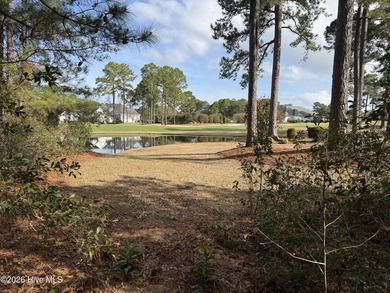 Beautiful 1/3-acre lot on the pond overlooking the fairway on #9 on Brunswick Plantation and Golf Resorts in North Carolina - for sale on GolfHomes.com, golf home, golf lot