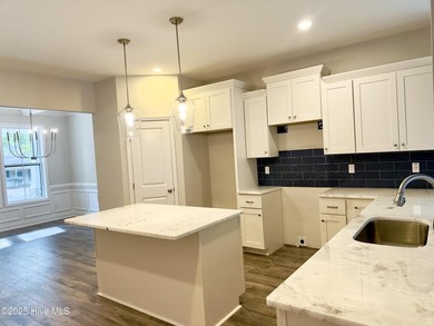 This stunning new 4-bedroom, 2.5-bath home in the gated Woodlake on Woodlake Country Club in North Carolina - for sale on GolfHomes.com, golf home, golf lot