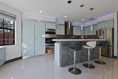 Stunning corner-lot home built in 2012, featuring modern design on Fontainebleau Golf Course in Florida - for sale on GolfHomes.com, golf home, golf lot