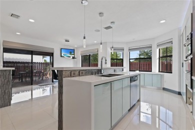 Stunning corner-lot home built in 2012, featuring modern design on Fontainebleau Golf Course in Florida - for sale on GolfHomes.com, golf home, golf lot