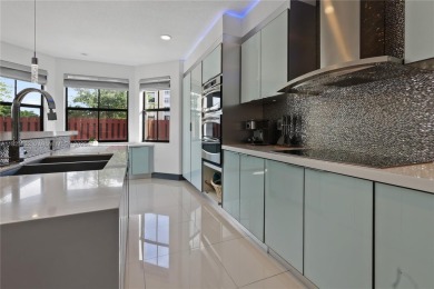 Stunning corner-lot home built in 2012, featuring modern design on Fontainebleau Golf Course in Florida - for sale on GolfHomes.com, golf home, golf lot