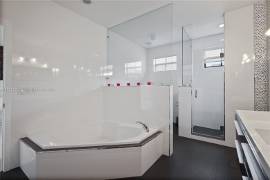 Stunning corner-lot home built in 2012, featuring modern design on Fontainebleau Golf Course in Florida - for sale on GolfHomes.com, golf home, golf lot
