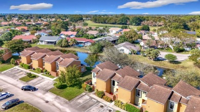 This beautifully renovated 2-bedroom, 2.5-bathroom townhouse on Woodmont Country Club in Florida - for sale on GolfHomes.com, golf home, golf lot