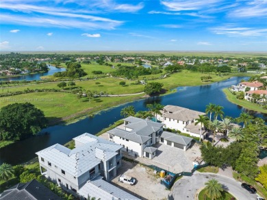 Welcome to your dream home in the exclusive Heron Estates. This on Heron Bay Golf Club in Florida - for sale on GolfHomes.com, golf home, golf lot