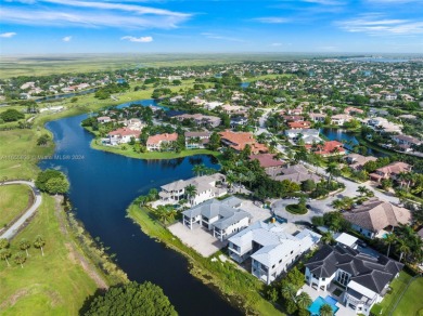 Welcome to your dream home in the exclusive Heron Estates. This on Heron Bay Golf Club in Florida - for sale on GolfHomes.com, golf home, golf lot